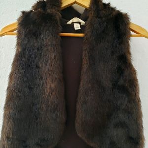 Girls faux fur vest with a hood